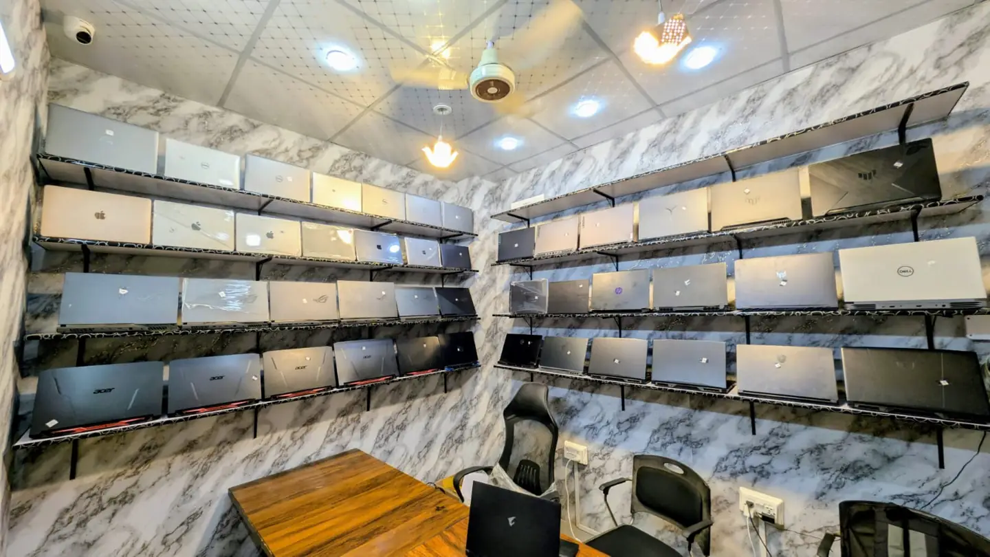 Gaming laptops on the display wall inside the Pixlaps shop, Haram City Plaza, Faisalabad